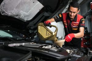 Cherry Capital Auto Clinic technician portrait in red uniform