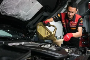 Cherry Capital Auto Clinic technician portrait in red uniform